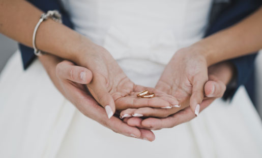 image of two sets of hands cradling each other lovingly